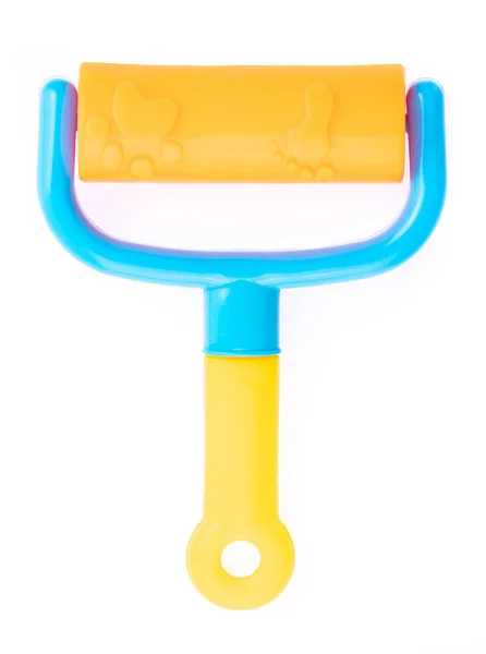 Escova de rolo de ferramenta de plástico de brinquedo de praia isolado no backgro branco — Fotografia de Stock