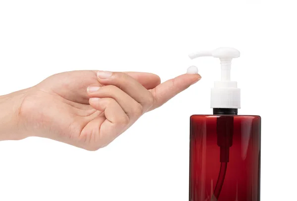 Young female hands pumping liquid soap from container isolated o — Stock Photo, Image