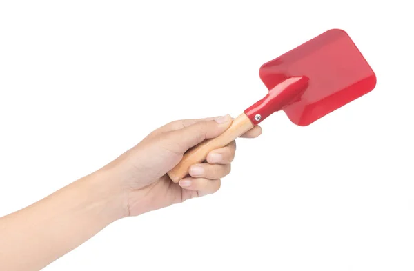 Hand holding Steel shovel with a wooden handle isolated on a whi — Stockfoto