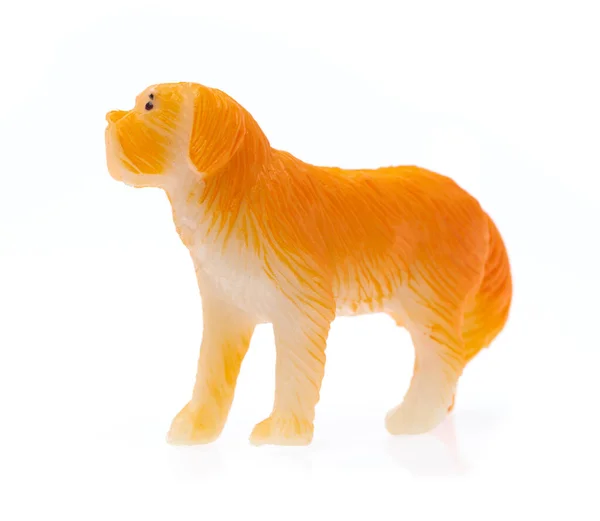 Cão de brinquedo feito de plástico isolado no fundo branco — Fotografia de Stock