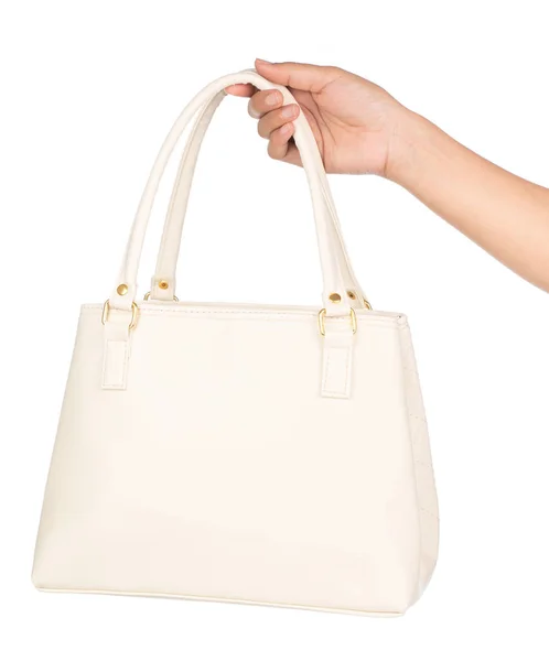 Mão segurando saco Acessórios de moda feminina isolado no branco b — Fotografia de Stock