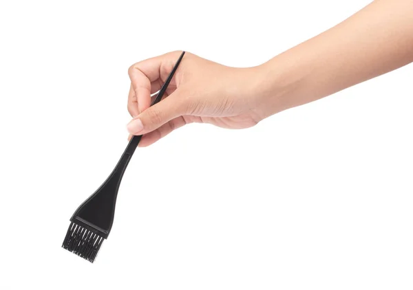 Hand hålla kam borste för hår dör isolerad på vit bakgrund — Stockfoto