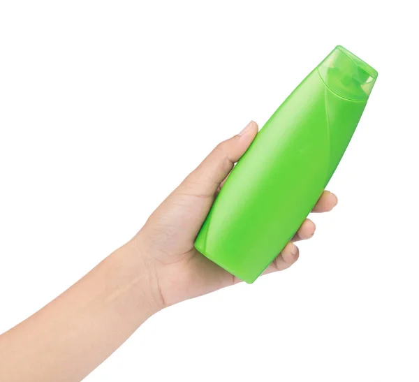 Ruční držení zelené plastové láhve šampónu izolované na bílém b — Stock fotografie