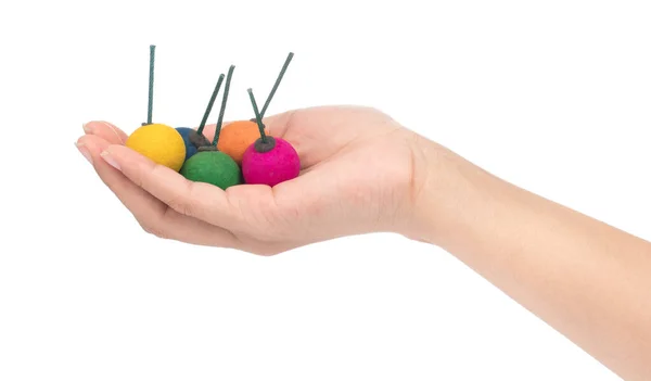 Hand holding bomb balls colorful isolated on a white background — 스톡 사진