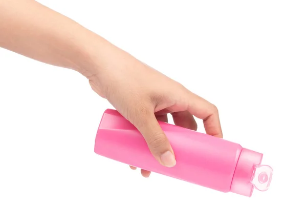 Mână care ține sticla de plastic roz de șampon izolat pe alb ba — Fotografie, imagine de stoc