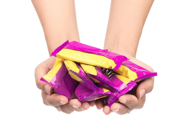 hand holding snack crisp packet isolated on white background