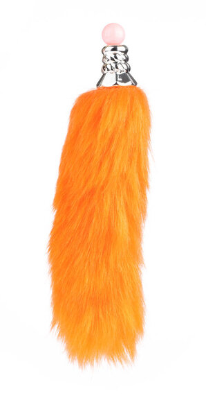 Orange keychains fox tail fur isolated on white background