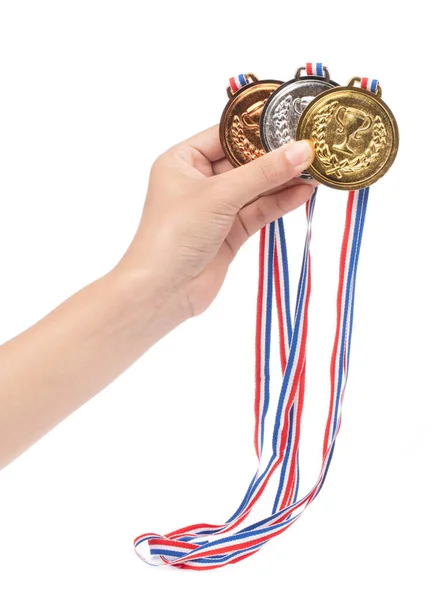 Mão segurando conjunto de medalhas premiadas isoladas em fundo branco . — Fotografia de Stock