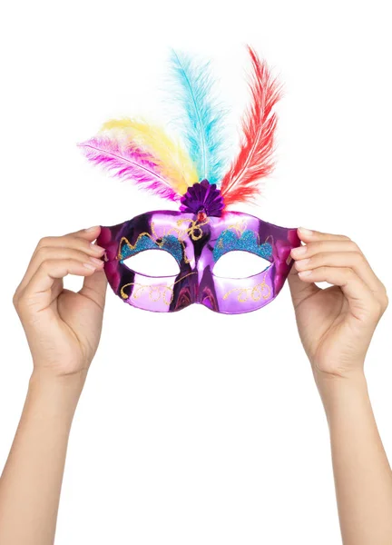 Hand holding carnival mask with feathers isolated on a white bac — Stock Photo, Image