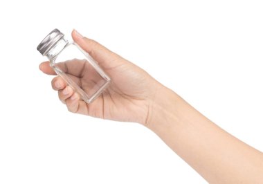 hand holding bottle glass for seasoning isolated on white backgr