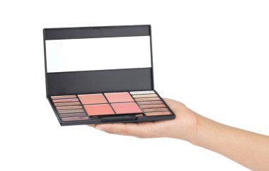 Hand holding eyeshadow palettes makeup isolated on a white backg