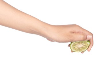 hand holding Bergamot fruit slice isolated on white background