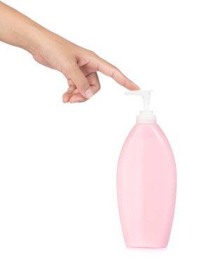 hands pumping out cream from bottle isolated on white background