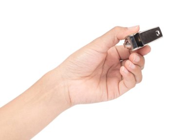 hand holding metal whistle isolated on white background