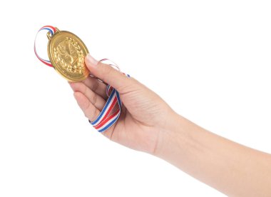 Winner hand raised and holding gold award medal with ribbon isol