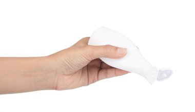 Hand holding cosmetic bottle isolated on white background