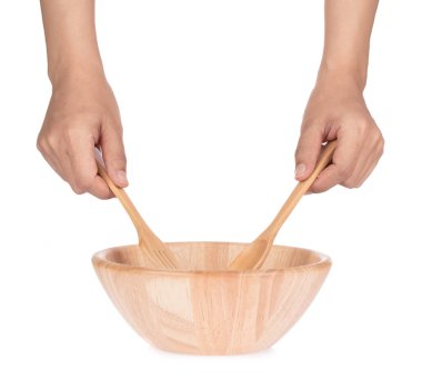 Hand holding Wood spoon and fork isolated on white background