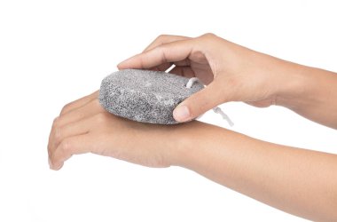 woman scrub hand by pumice stone isolated on white background 