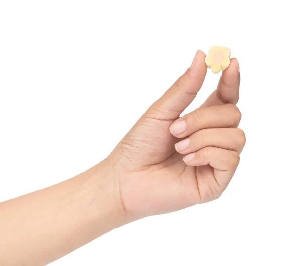 Hand holding sweet marshmallow in the shape of flower isolated o — Stockfoto