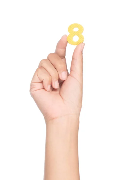 Mão segurando número feito de espuma EVA isolado no backgro branco — Fotografia de Stock