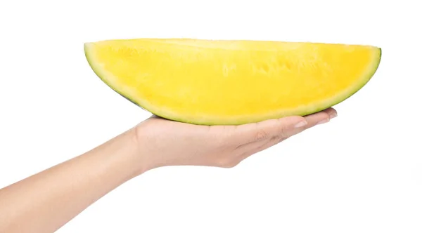 Hand holding yellow watermelon slice isolated on white backgroun — 图库照片