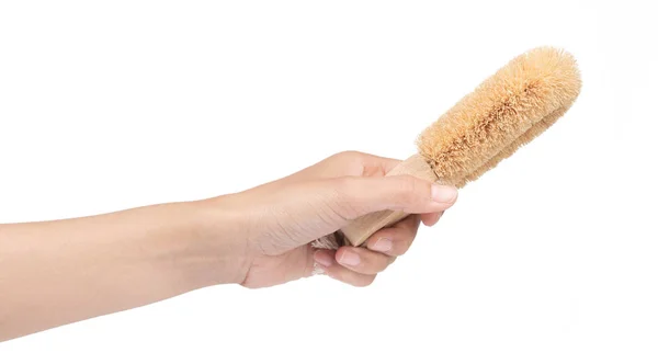 Hand holding Wooden body bath brush isolated on white background — ストック写真