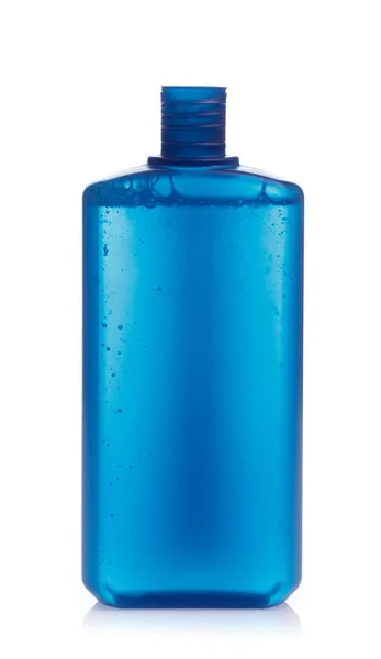 En blå flaska produkt kosmetisk hudvård isolerad på vit bakgr — Stockfoto