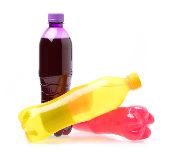 Refreshing pineapple ,raspberry, and grape drink in plastic bott — 스톡 사진