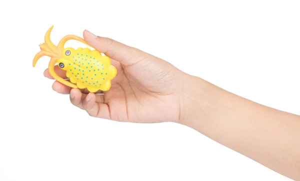Hand holding octopus toy isolated on white background — 图库照片