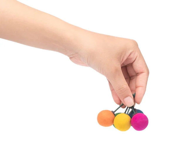 Kéz gazdaság bomba labdák színes elszigetelt fehér háttér — Stock Fotó
