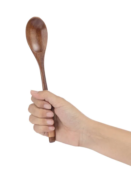 Hand holding wooden spoon isolated on white background — Stock Photo, Image