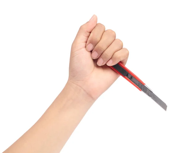 Hand holding Red cutter knife isolated on white background — Stok fotoğraf