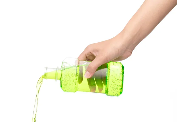 Hand pouring water mouthwash isolated on white background — Stok fotoğraf
