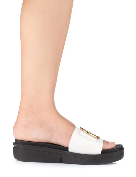 Female Leg Wearing Sandals isolated on a white background — 스톡 사진