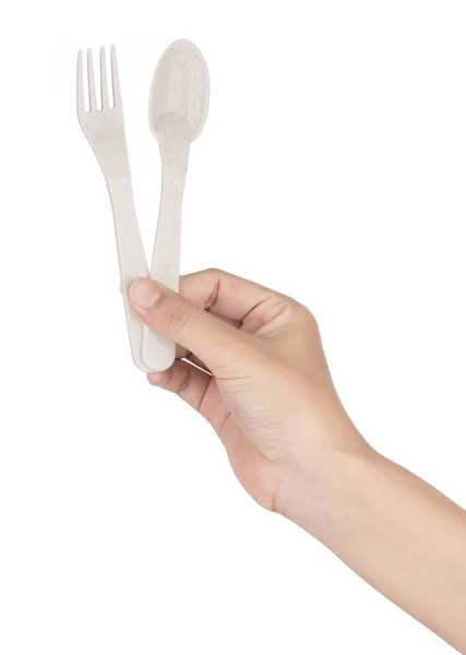 Hand holding Biodegradable plastic spoon and fork isolated on wh — ストック写真