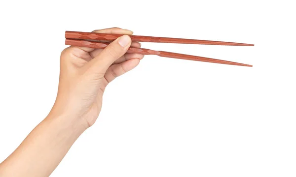 Ξύλο chopsticks που συγκρατεί το χέρι και απομονώνεται σε λευκό φόντο — Φωτογραφία Αρχείου
