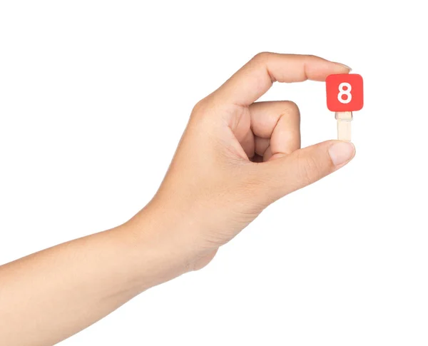 Sujetador de mano pinza de madera con números 8 aislado en un blanco —  Fotos de Stock