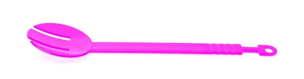 Pink plastic kitchen utensil isolated on a white background — Stockfoto