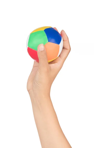 Рука держит шар игрушки изолированы на белом фоне — стоковое фото