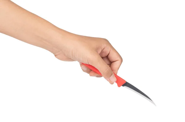 Рука с ножом для резьбы фруктов на белом фоне Лицензионные Стоковые Изображения