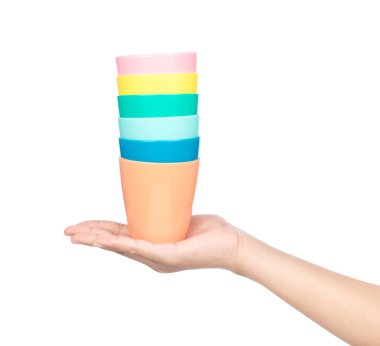 hand holding set of plastic glass isolated on a white background