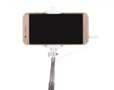 selfie stick with  mobile phone isolated on a white background