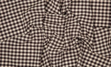 Texture of fabric in a chess cage for wallpaper and background