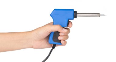 hand holding Gun electric solder for soldering electronic work i