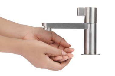 Washing hands under tap isolated on white background.