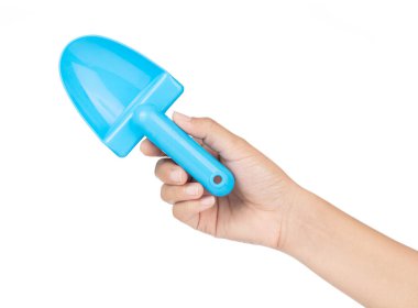 Hand holding Toy plastic blue of shovel isolated on a white back