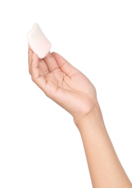 hand holding cosmetic sponges isolated on white background