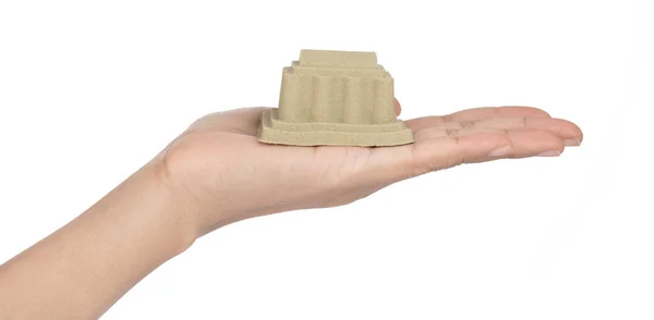 Hand houden zandsculptuur van kasteel geïsoleerd op een witte rug gr — Stockfoto
