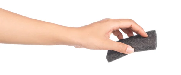 Hand holding black sponge isolated on white background — Stock Photo, Image