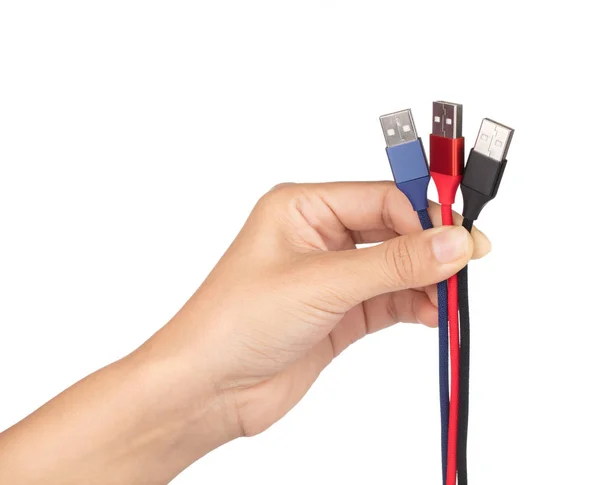 Hand holding set of USB cable for smartphone isolated on white b — 스톡 사진